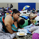 Florida residents hunkering down in Miami in one of the state’s 320 shelters. Image via the AP.